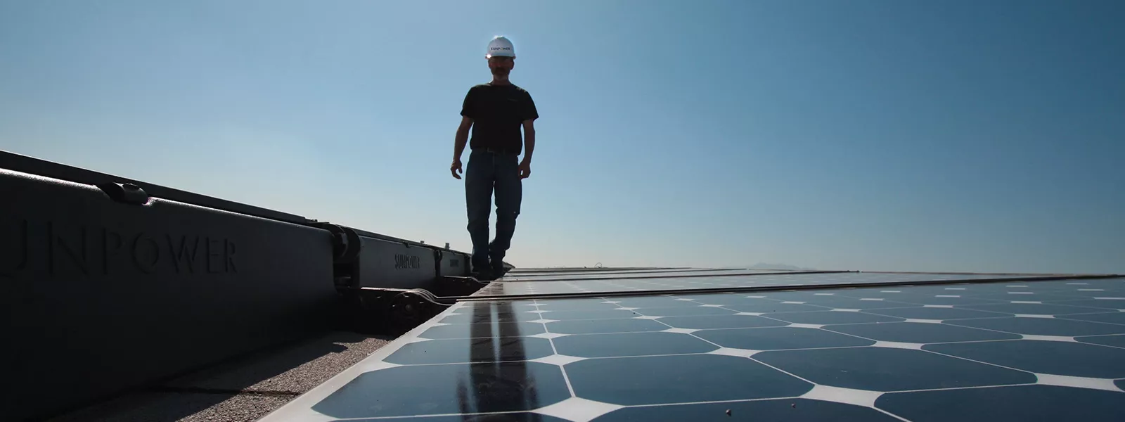 solar installer on rooftop installation