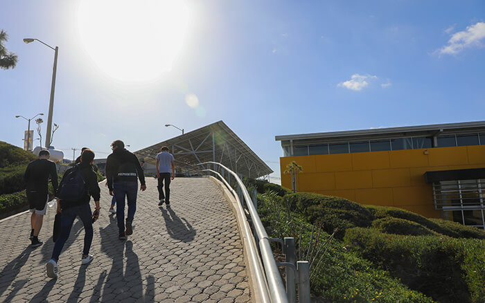 CETYS Students Walking to the Renewable Solar Energy Carport