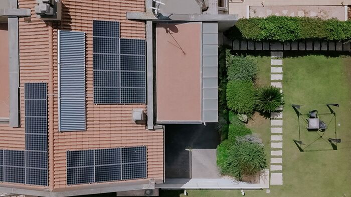 Aerial view of home with solar panels