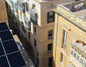 Shifting from fossil fuels to a net-zero future with Maxeon SunPower solar technology, installed on a rooftop in the city centre of Malta.  